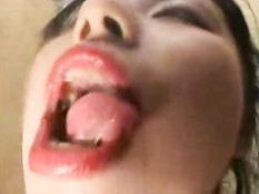 Asian girl licking window