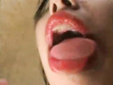 Asian girl licking window