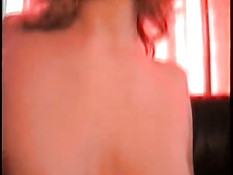 Young blonde sucking in red light