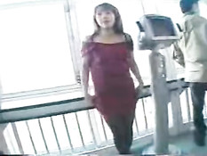 Asian babe stripping off