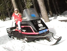 Coldresistant babe strips on snowmobile